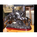 A resin sculpture of horse racing by Academy