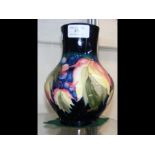 A Moorcroft Pottery vase with tube lined decoratio