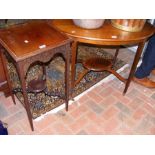 An Edwardian two tier occasional table together wi