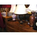 Three table lamps of varying shape, size and style