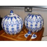 A pair of blue and white ginger jars