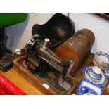A vintage Singer sewing machine, together with a c