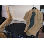 Assorted military uniforms and clothes in travelli