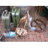 An old petrol can together with a suitcase in the