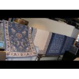 Four 150cm x 80cm floor rugs of varying design