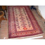 A Middle Eastern rug with geometric border and cen