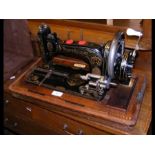 A Frister & Rossmann sewing machine in case