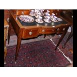 An Edwardian writing desk with square tapering sup