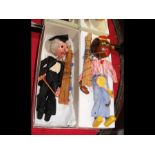 A pair of boxed Pelham Puppets - Minstrel with banjo and Schoolmaster