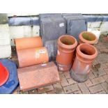 A medley chimney pots, cowls and roof slates etc