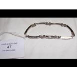 An 18ct white gold and diamond lady's bracelet