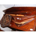 Old boomerangs, carved wooden bowl