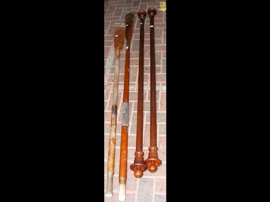 A pair of wooden curtain poles, together with vint