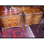 A pair of serpentine fronted three drawer walnut b