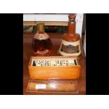 A cased set of old dominoes, Dimple Scotch whiskey