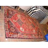 A Middle Eastern rug with geometric border - 242cm