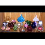 A collection of glass paper weights, including sev