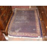 A Middle Eastern rug with geometric border and dar