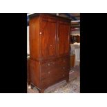 A Victorian mahogany linen press with two short an