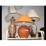 Three table lamps of varying size and shape