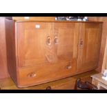 An Ercol Golden Dawn sideboard with drawer and cup