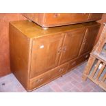 An Ercol Golden Dawn sideboard with cupboards and