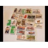 A box containing cigarette cards (approx. 30 packs