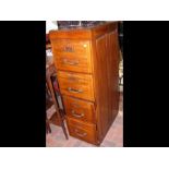 An antique four drawer filing cabinet