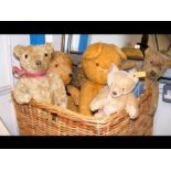 A basket of vintage bears, including a small Steif