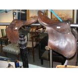 Two leather riding saddles