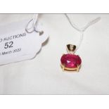An 18ct gold diamond and ruby pendant