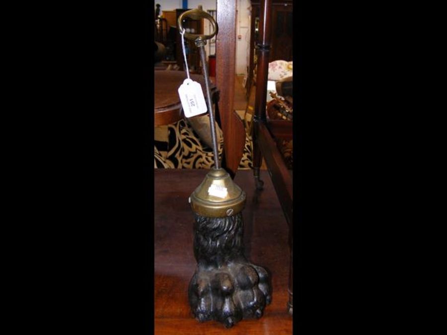 An unusual doorstop in the form of cast metal lion