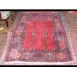 A Middle Eastern carpet with geometric border and