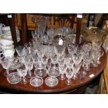 A quantity of cut glass goblets, Brandy balloons,