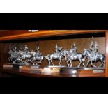 Six silver plate soldiers on horseback