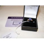 A tanzanite and diamond ring in gold setting with