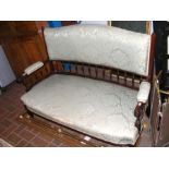 An Edwardian curved back settee