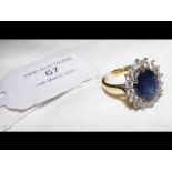 A diamond and sapphire dress ring in 18ct gold set