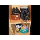 A collection of vintage binoculars, including Magn