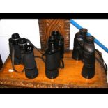 Three vintage binoculars