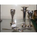 Two silver spoons together with silver spi