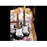 A pair of Gear4music electric guitars