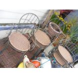 Six wrought iron garden chairs with canework seats