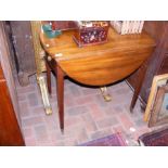 An antique mahogany Pembroke table with single dra
