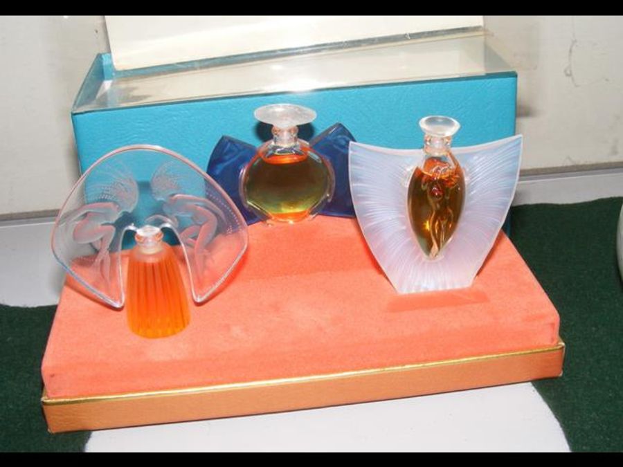 A boxed set of Lalique scent bottles