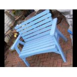 A wooden painted blue garden bench