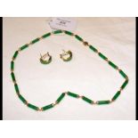 A 14ct jade necklace with 14ct earrings