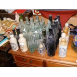 A combination of glass Codd Bottles and stoneware