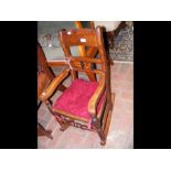 An antique childs rocking chair