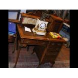 An Edwardian Maple & Co. writing desk with shaped